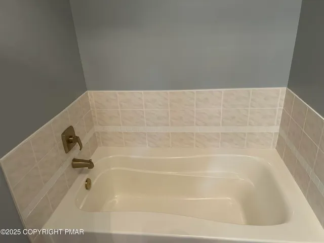 a bathroom with a bathtub