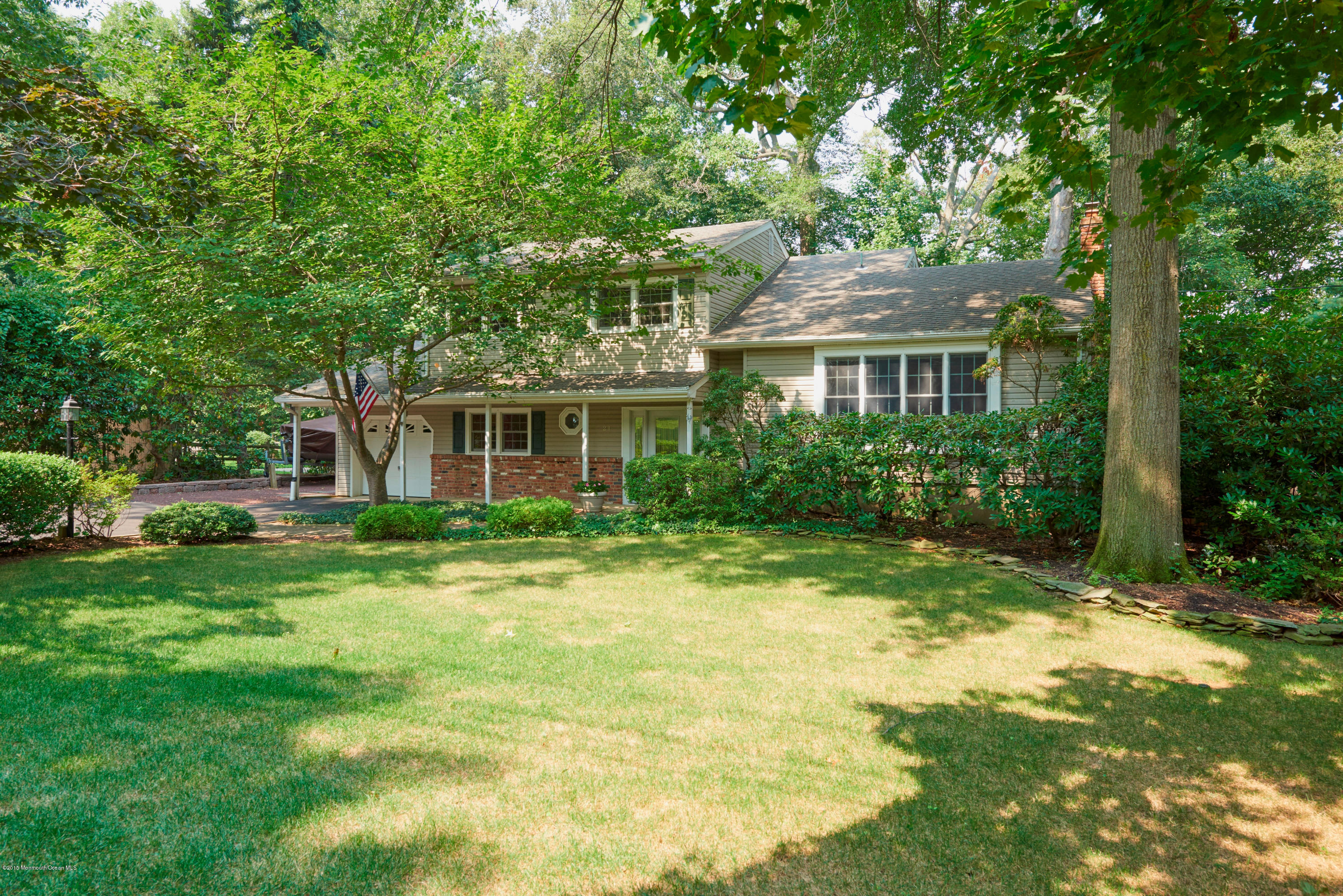 21 Crest Road Middletown, NJ 07748 - Photo 1 of 34 a front view of house with yard and green space