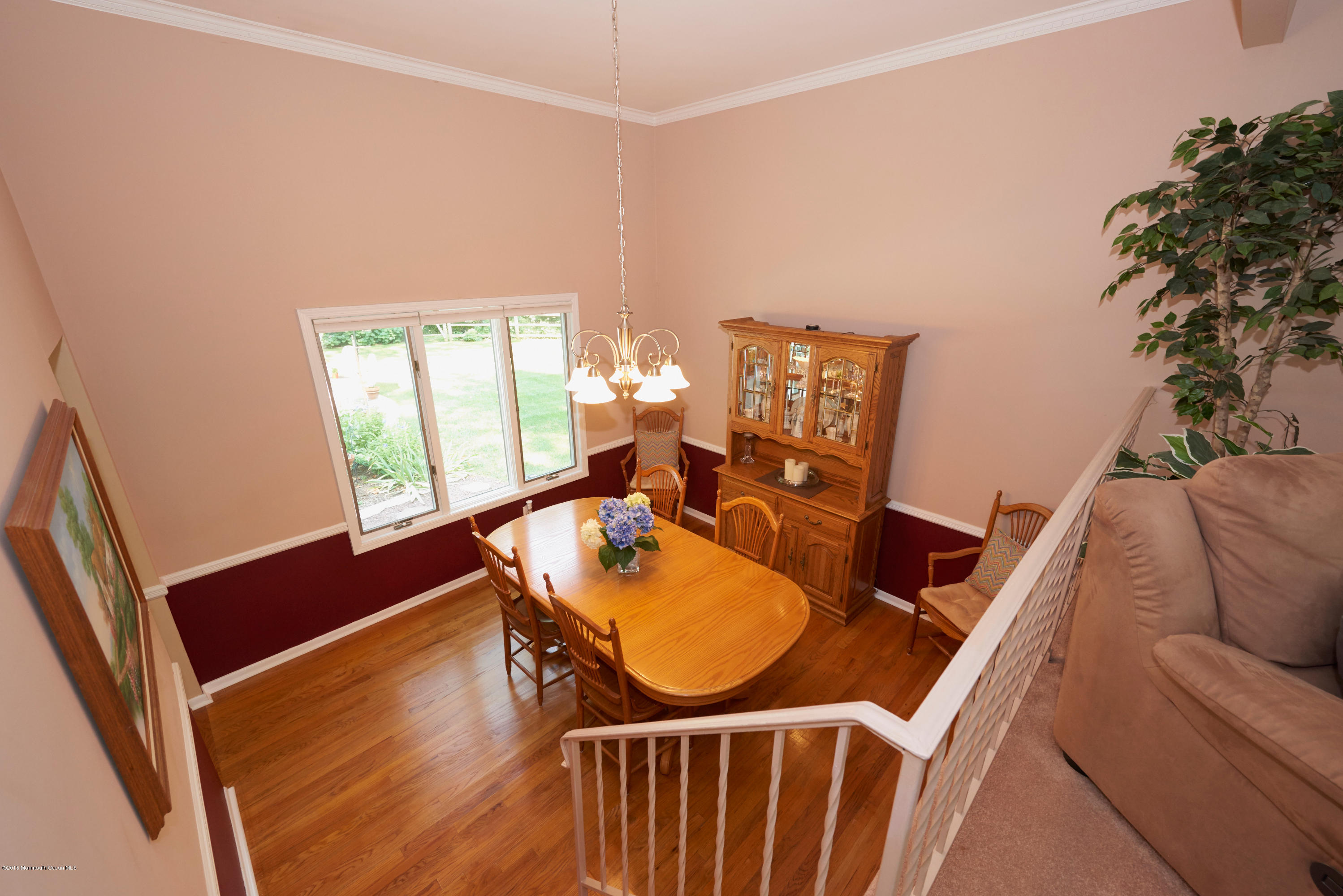 21 Crest Road Middletown, NJ 07748 - Photo 13 of 34 a living room with furniture a dining table and wooden floor