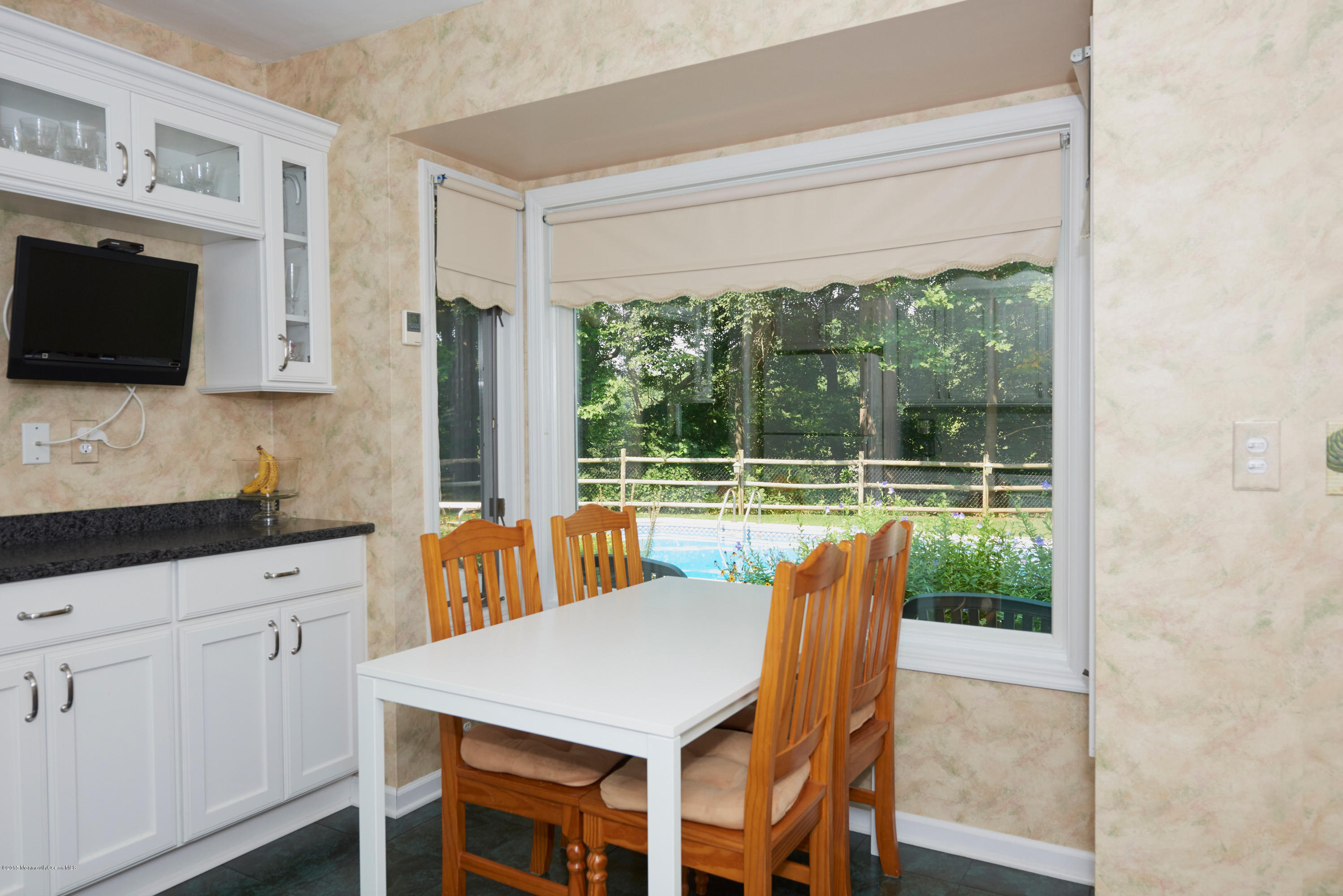 21 Crest Road Middletown, NJ 07748 - Photo 16 of 34 a view of a dining room with furniture window and outside view