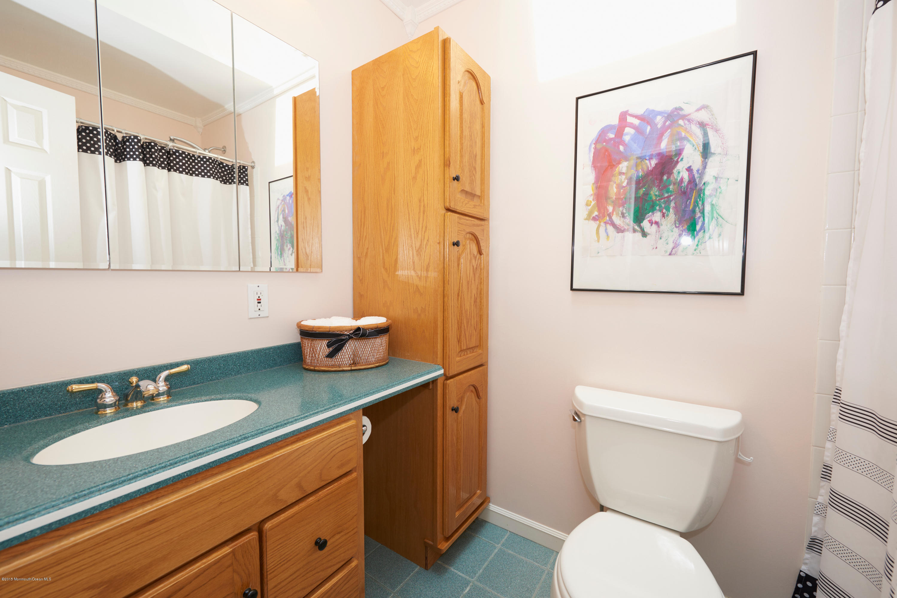 21 Crest Road Middletown, NJ 07748 - Photo 26 of 34 a bathroom with a toilet sink and mirror