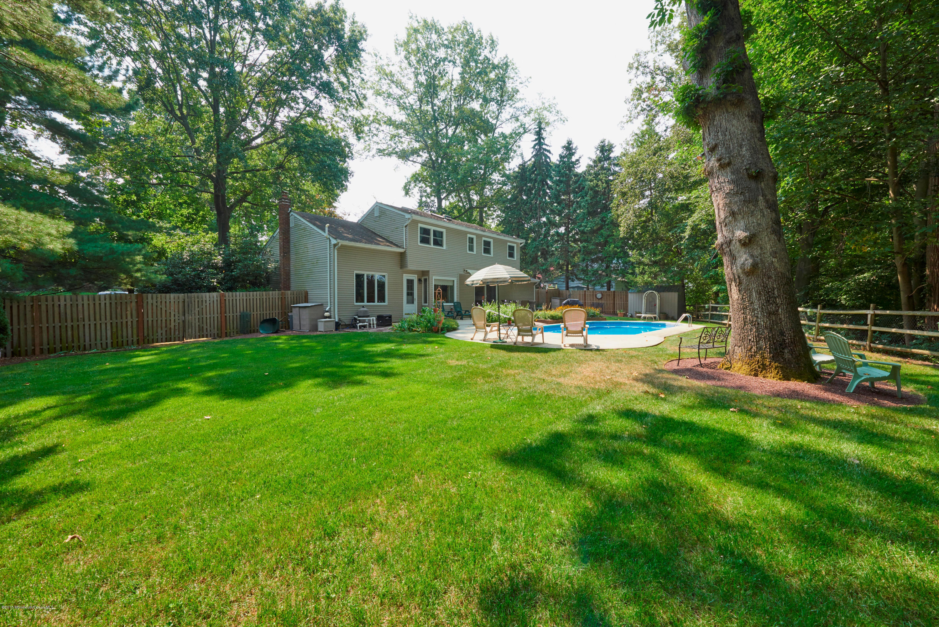 21 Crest Road Middletown, NJ 07748 - Photo 33 of 34 a view of a house with backyard and a slide