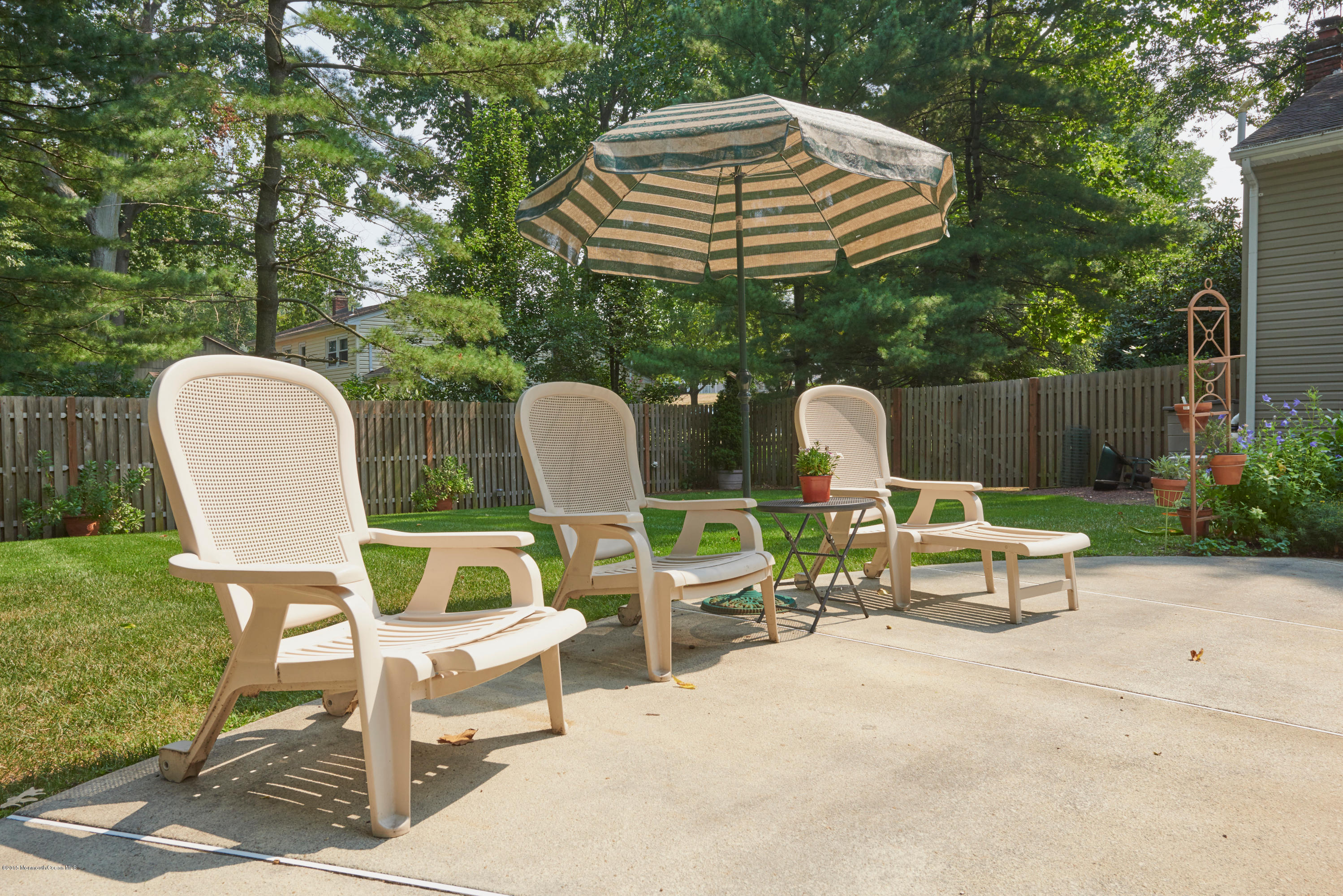 21 Crest Road Middletown, NJ 07748 - Photo 34 of 34 a table and chairs in a patio