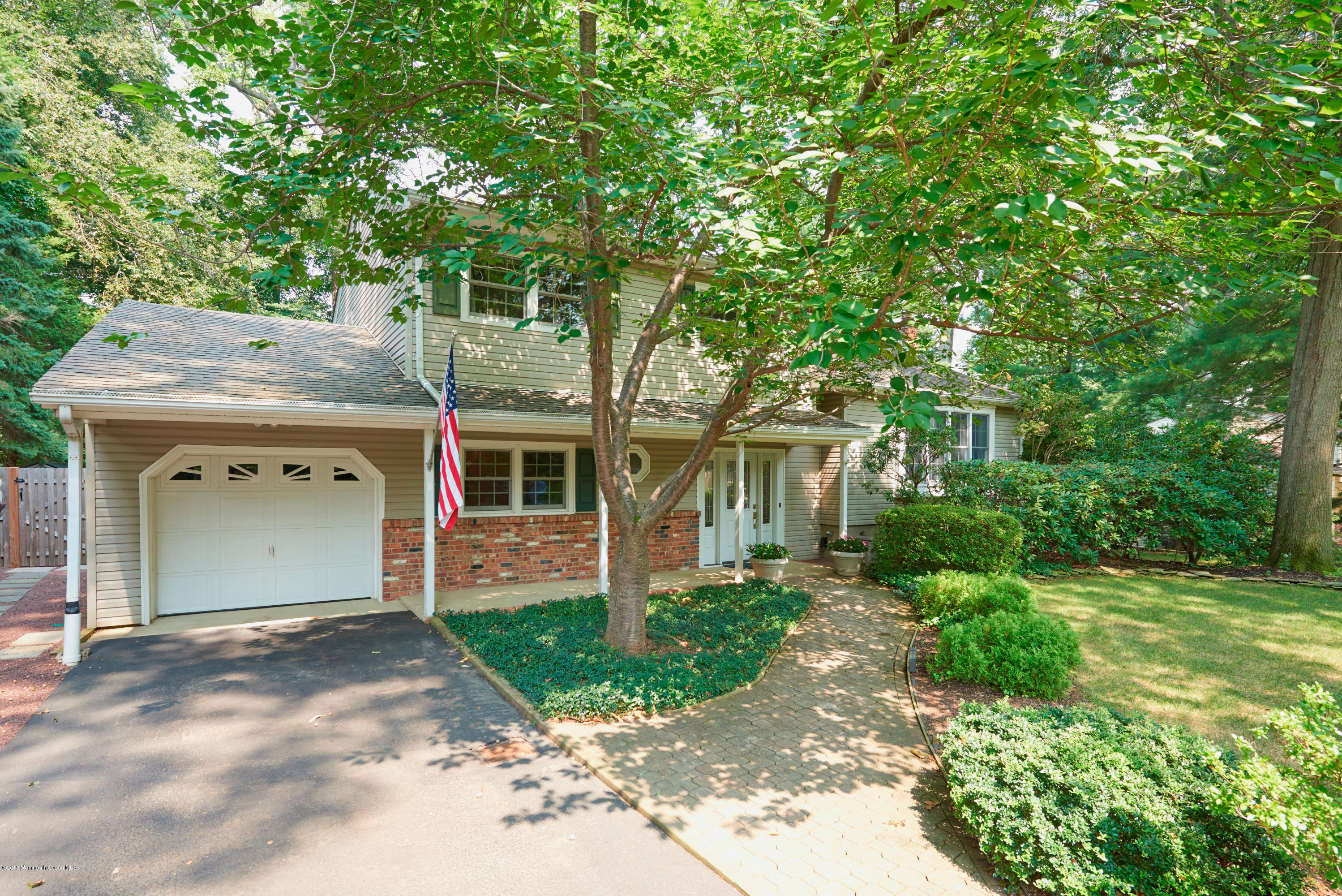21 Crest Road Middletown, NJ 07748 - Photo 5 of 34 a front view of a house with garden