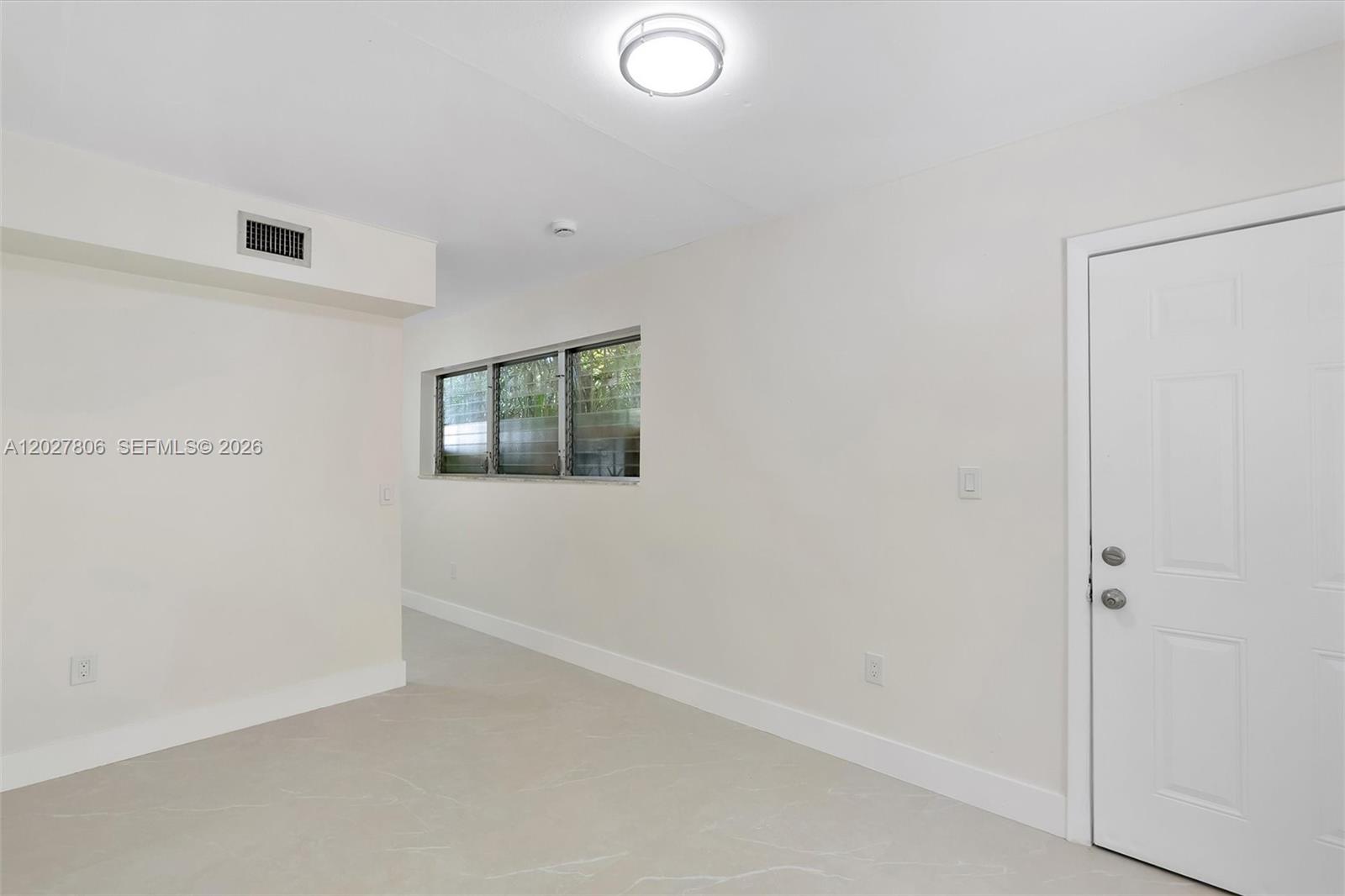 1612 Southwest 23rd Street, Unit 1612 Miami, FL 33145 - Photo 27 of 42 an empty room with windows
