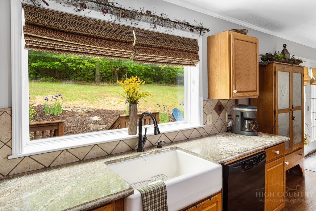 970 Vox Road Sparta, NC 28675 - Photo 21 of 50 a kitchen with a sink and a large window