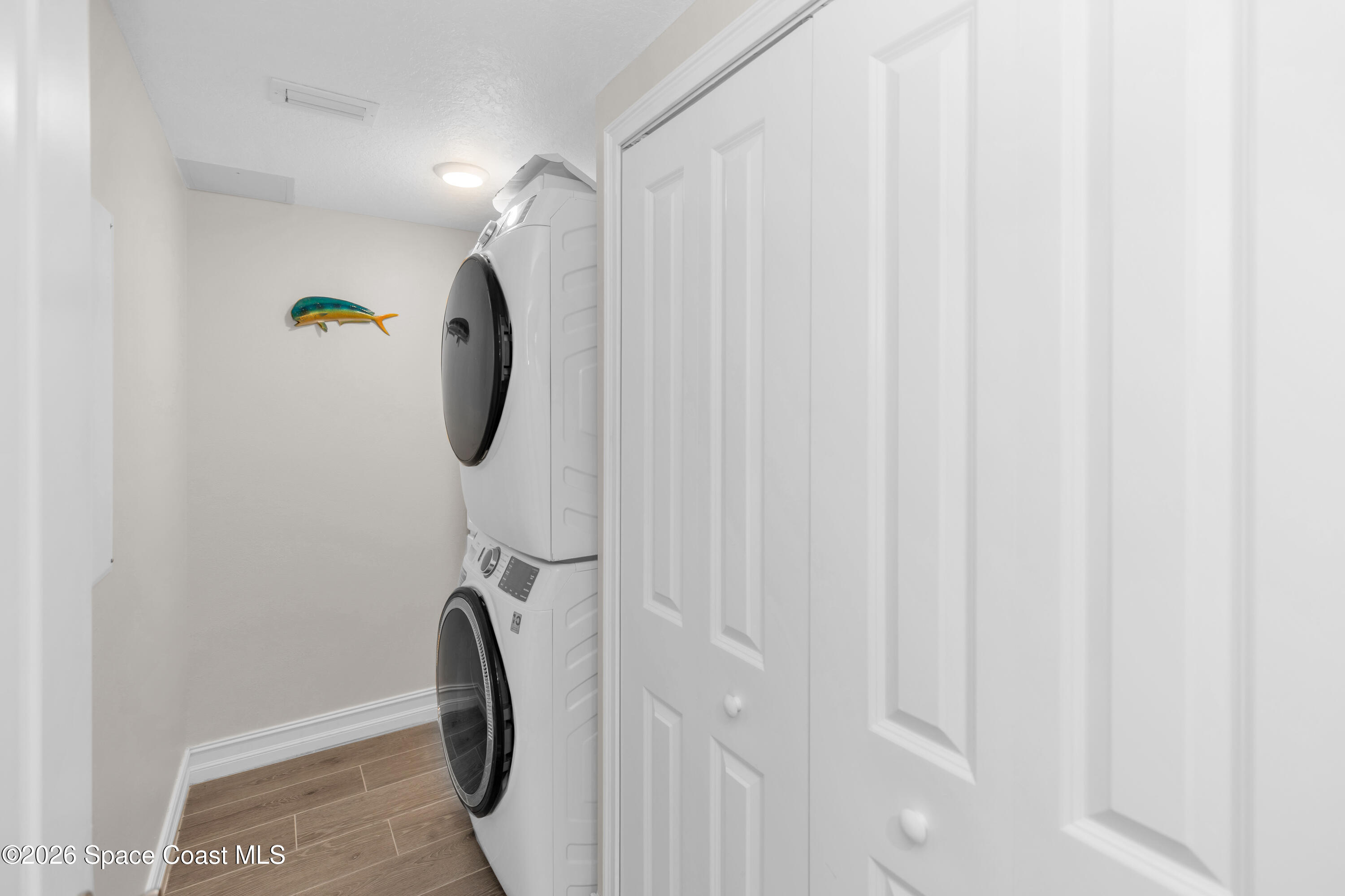 1805 Riverside Drive, Unit 506 Titusville, FL 32780 - Photo 19 of 24 a bathroom with a shower curtain and a mirror