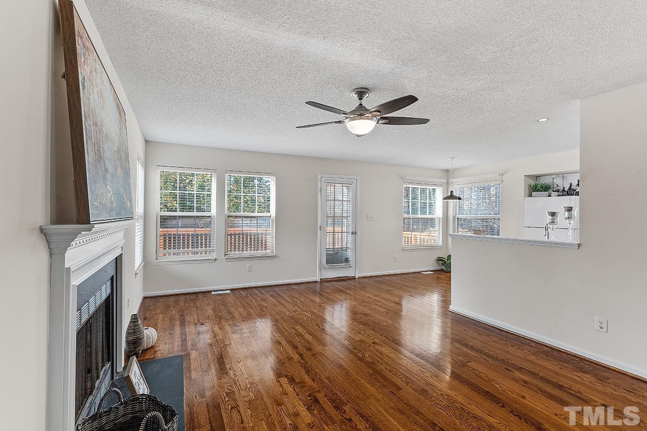 5504 Botany Bay Drive Raleigh, NC 27616 - Photo 13 of 23 a view of an empty room with wooden floor and a window