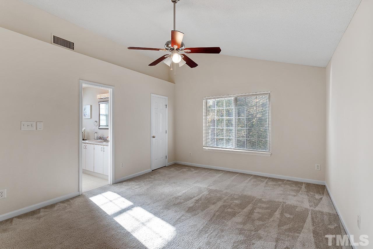 5504 Botany Bay Drive Raleigh, NC 27616 - Photo 15 of 23 a view of empty room with window and chandelier fan