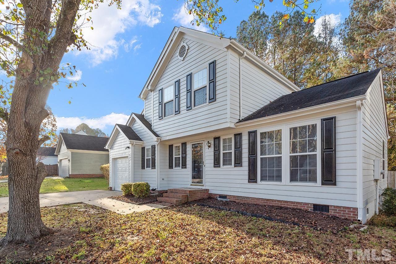 5504 Botany Bay Drive Raleigh, NC 27616 - Photo 2 of 23 a view of a white house with large tree next to a large tree