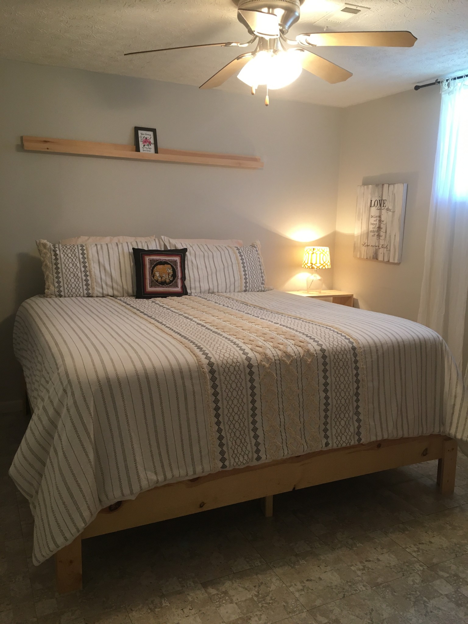 339 Fountainhead Road Portland, TN 37148 - Photo 5 of 7 a bedroom with a bed and a chandelier