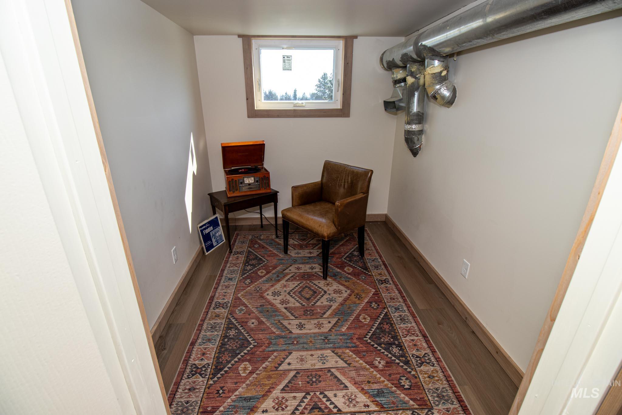 263 Glory Lane Orofino, ID 83544 - Photo 26 of 48 Living area featuring wood finished floors and baseboards