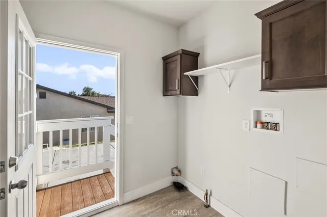 a view of an entryway with wooden floor