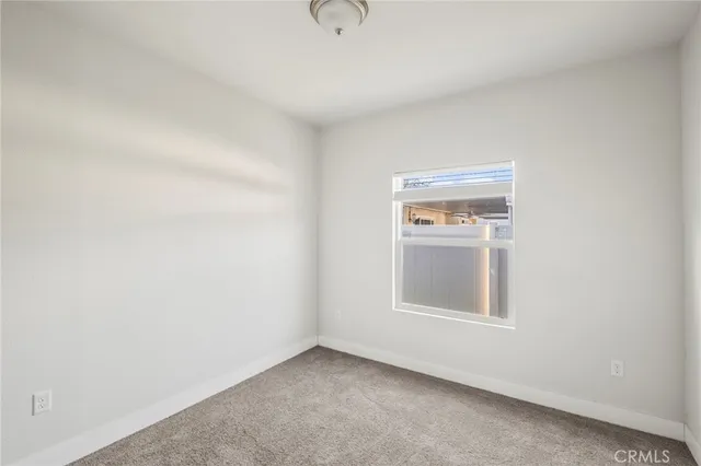 a view of backyard with a wooden fence