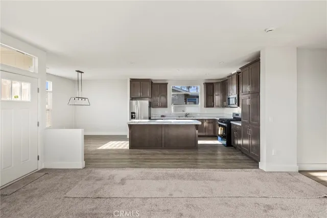 a view of kitchen with granite countertop counter top space and stainless steel appliances
