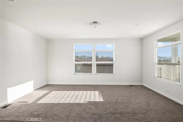 a view of kitchen with granite countertop lots of counter top space