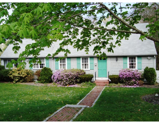 118 Tilden Road Scituate, MA 02066 - Photo 1 of 8 a front view of a house with a garden and plants