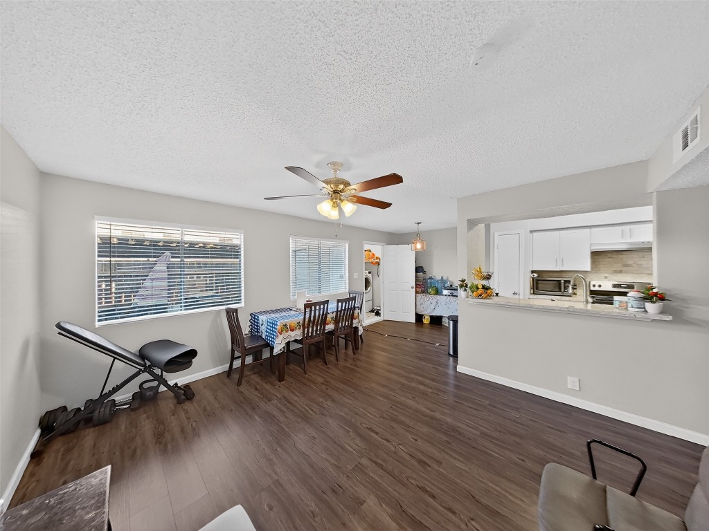 8101 Amelia Road, Unit 404 Houston, TX 77055 - Photo 16 of 39 a view of a dining room with furniture window and wooden floor