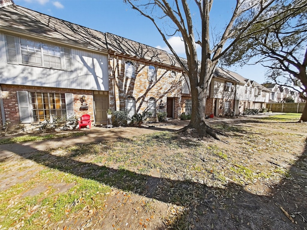 8101 Amelia Road, Unit 404 Houston, TX 77055 - Photo 2 of 39 a view of street with large trees