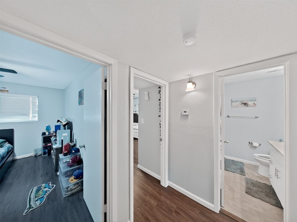 8101 Amelia Road, Unit 404 Houston, TX 77055 - Photo 24 of 39 a view of a hallway with wooden floor and closet area