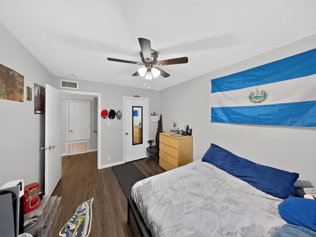8101 Amelia Road, Unit 404 Houston, TX 77055 - Photo 26 of 39 a bed room with a bed and a chandelier