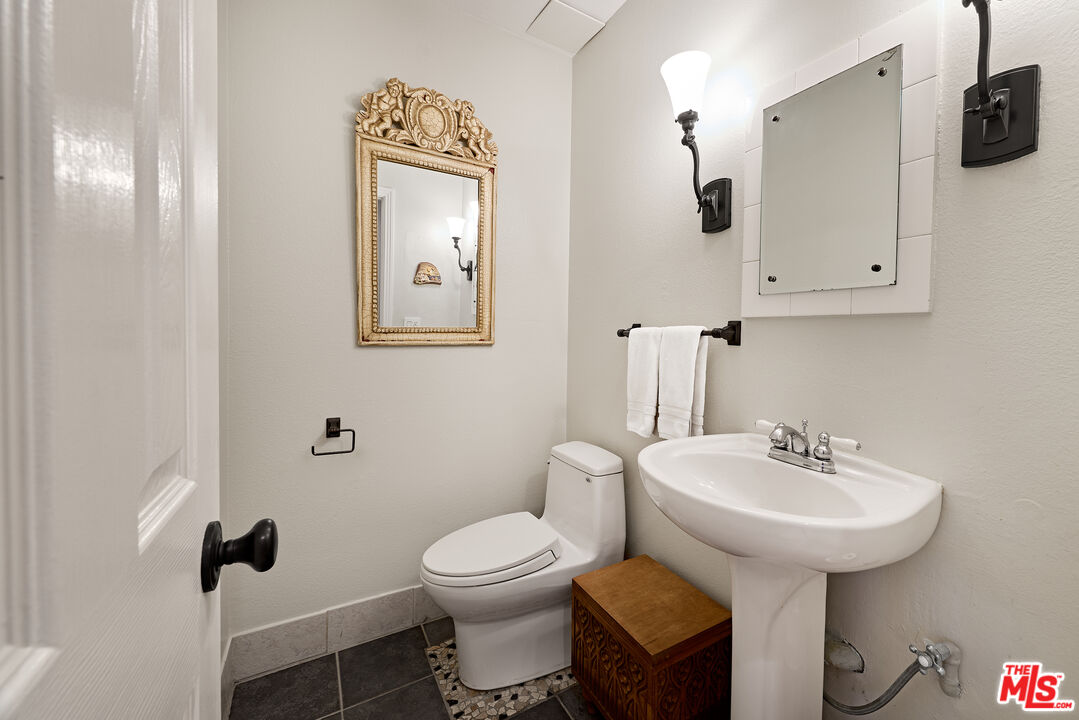 697 Washington Boulevard Marina del Rey, CA 90292 - Photo 16 of 23 a bathroom with a toilet sink and mirror