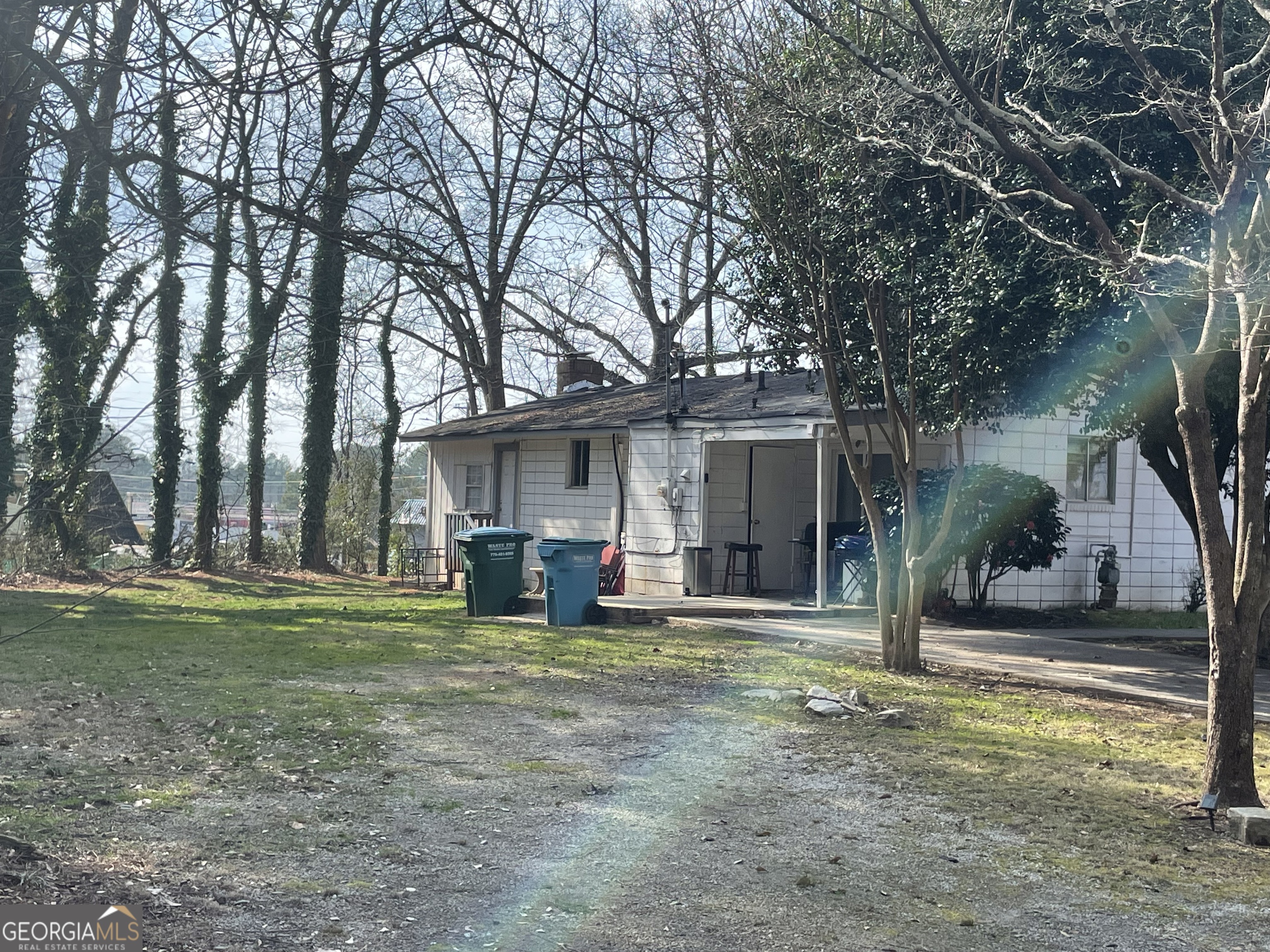 2155 A Rosedale Road Snellville, GA 30078 - Photo 8 of 11 a view of a house with a yard patio and fire pit