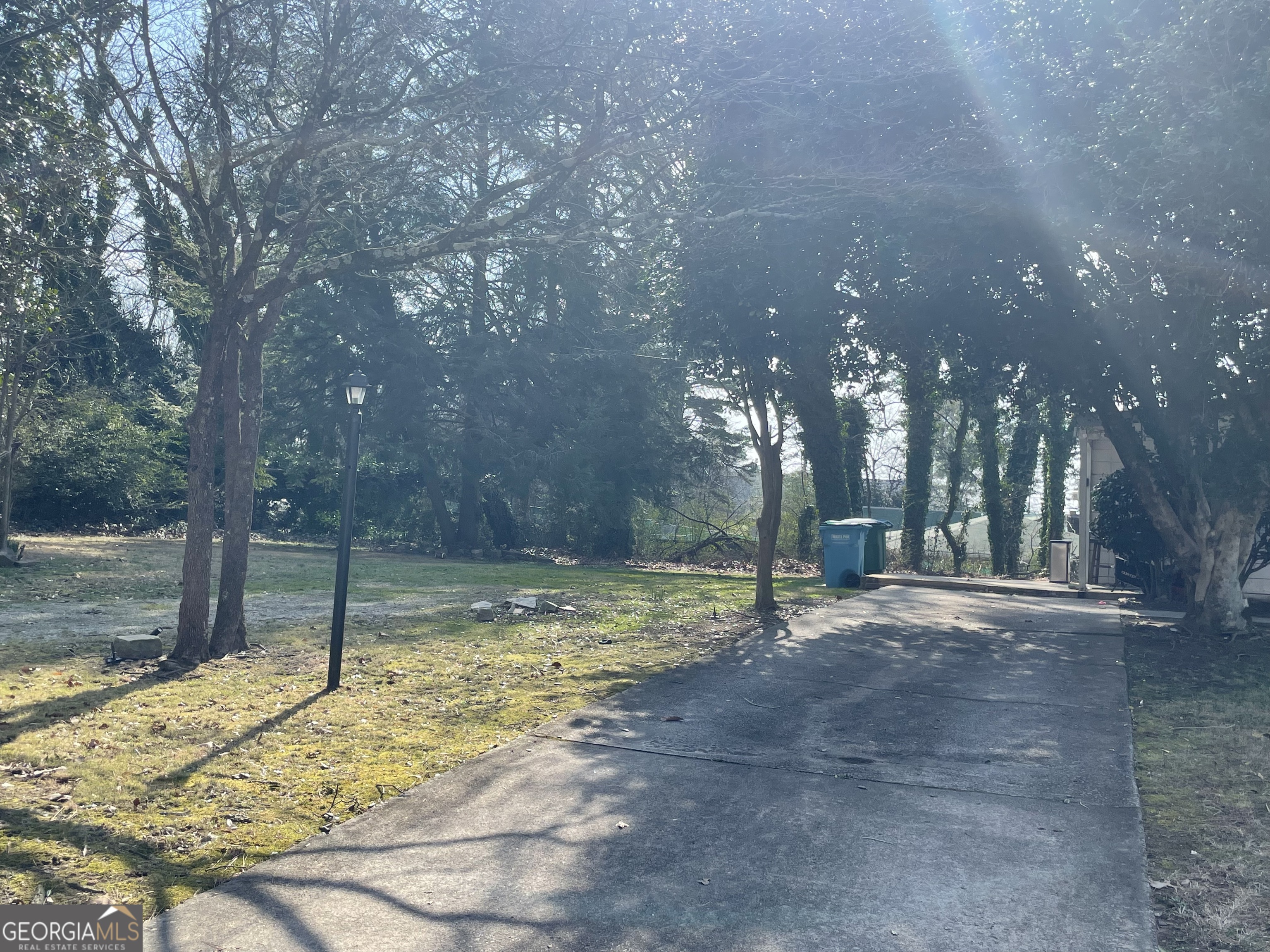 2155 A Rosedale Road Snellville, GA 30078 - Photo 10 of 11 a backyard of a house with lots of green space and lake view