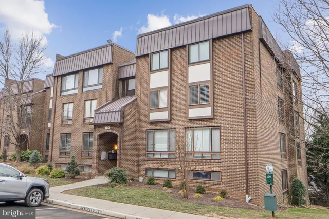 a view of a car park in front of a building