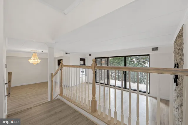 a view of staircase with wooden floor