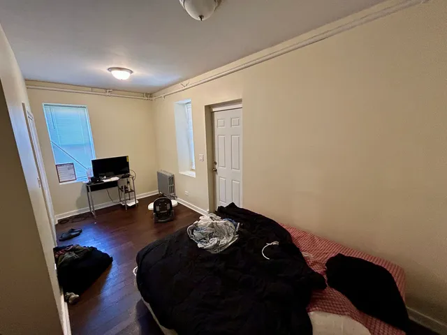 a room with furniture and wooden floor