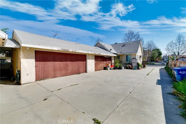 a view of the house with a yard