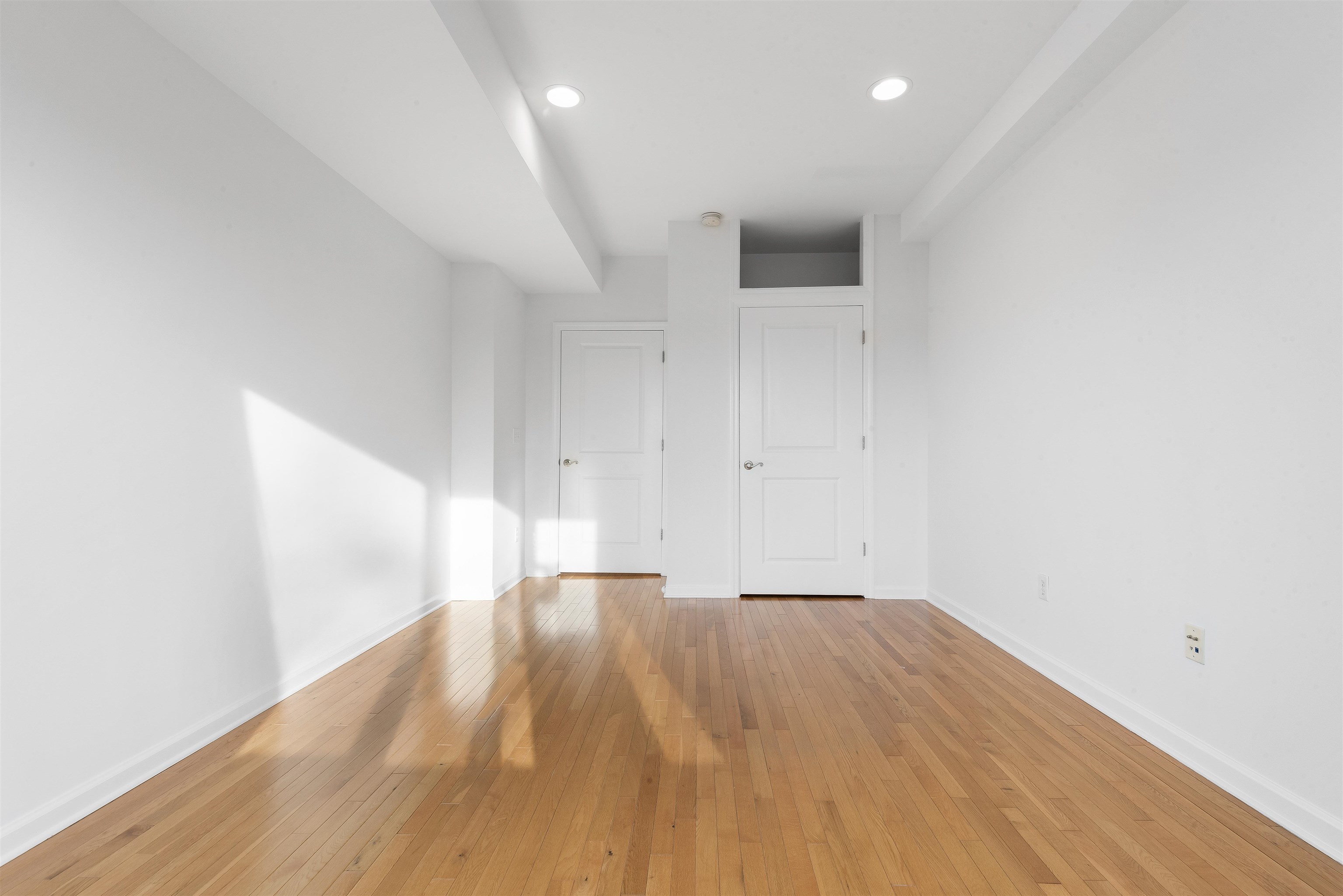203-207 Hackensack Plank Road, Unit 5B Weehawken, NJ 07086 - Photo 13 of 18 a view of empty room with wooden floor