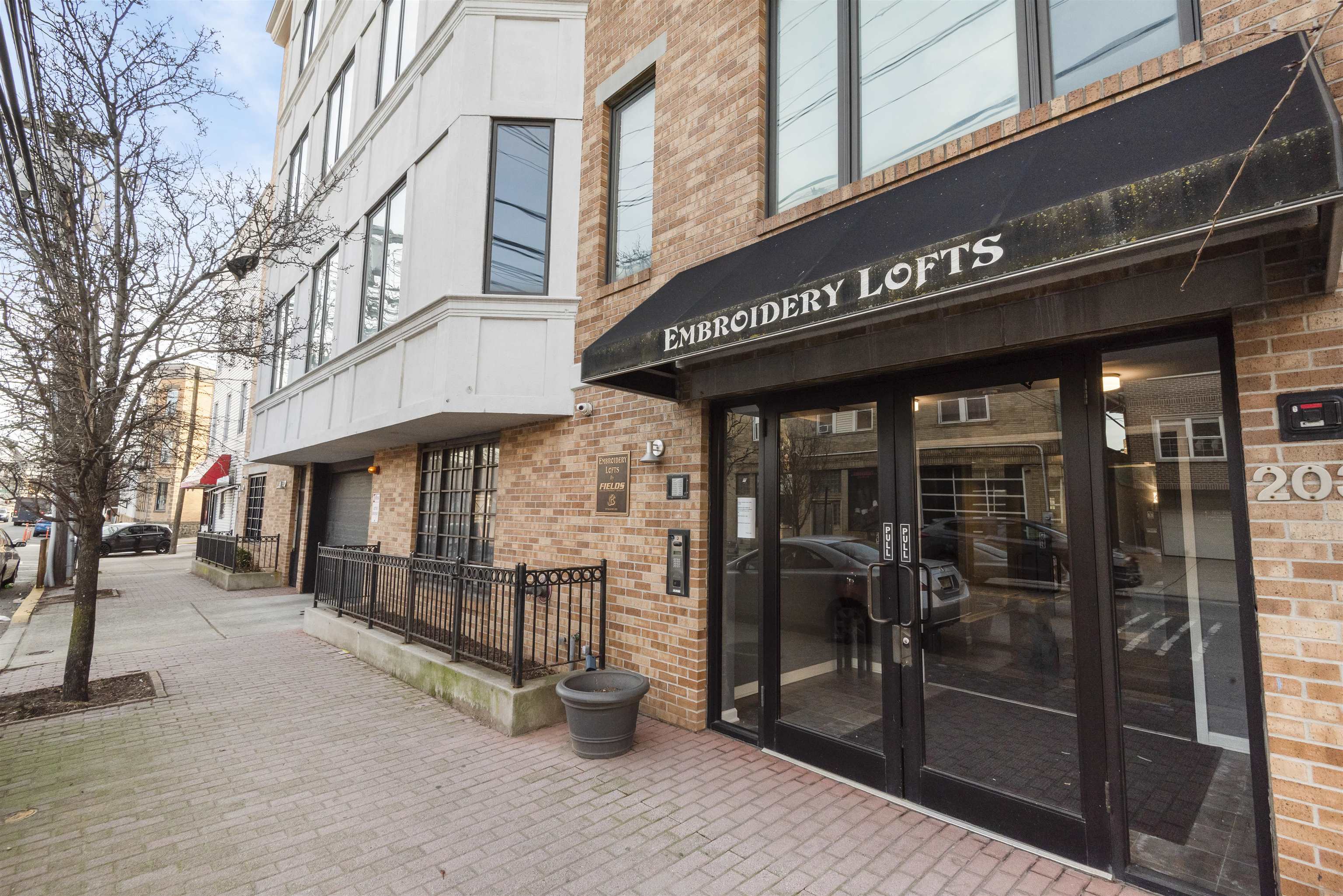 203-207 Hackensack Plank Road, Unit 5B Weehawken, NJ 07086 - Photo 18 of 18 a view of a building with a street