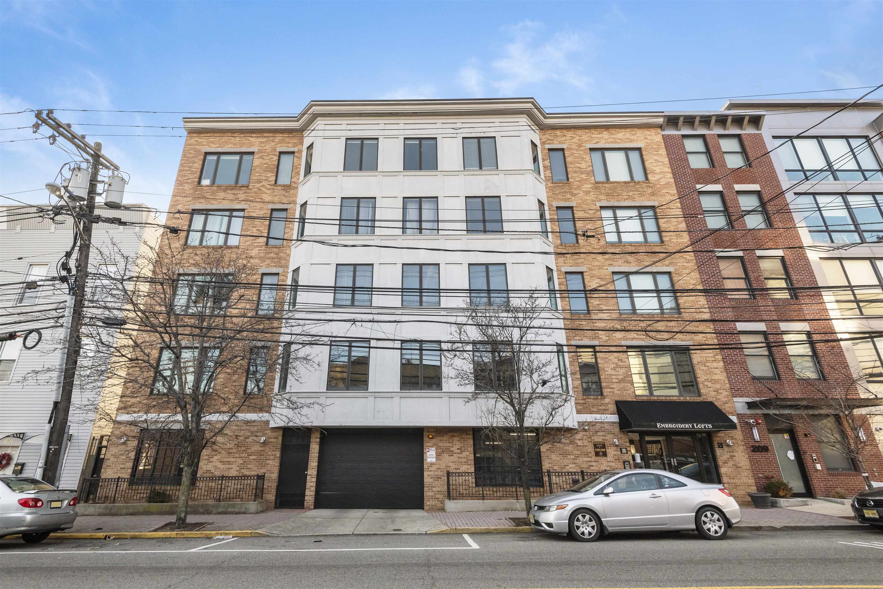 203-207 Hackensack Plank Road, Unit 5B Weehawken, NJ 07086 - Photo 2 of 18 a car parked in front of a big house