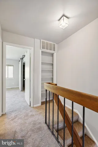 a view of a hallway with windows