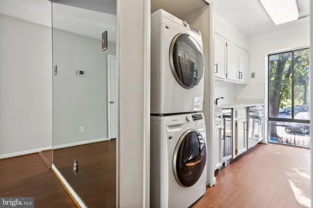a view of a hallway with washer and dryer