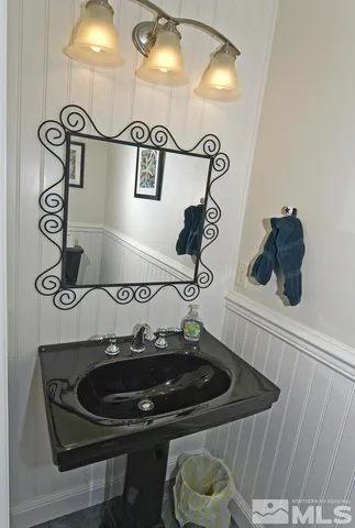 a bedroom with a bed and glass window