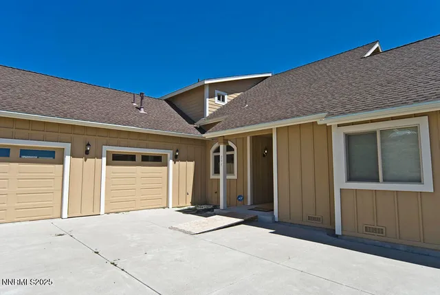 a kitchen with granite countertop a stove sink and cabinets