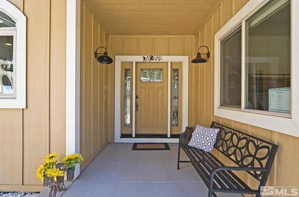 a kitchen with granite countertop a stove sink and cabinets