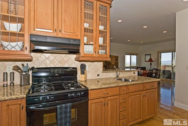 a view of a dining room with furniture and window