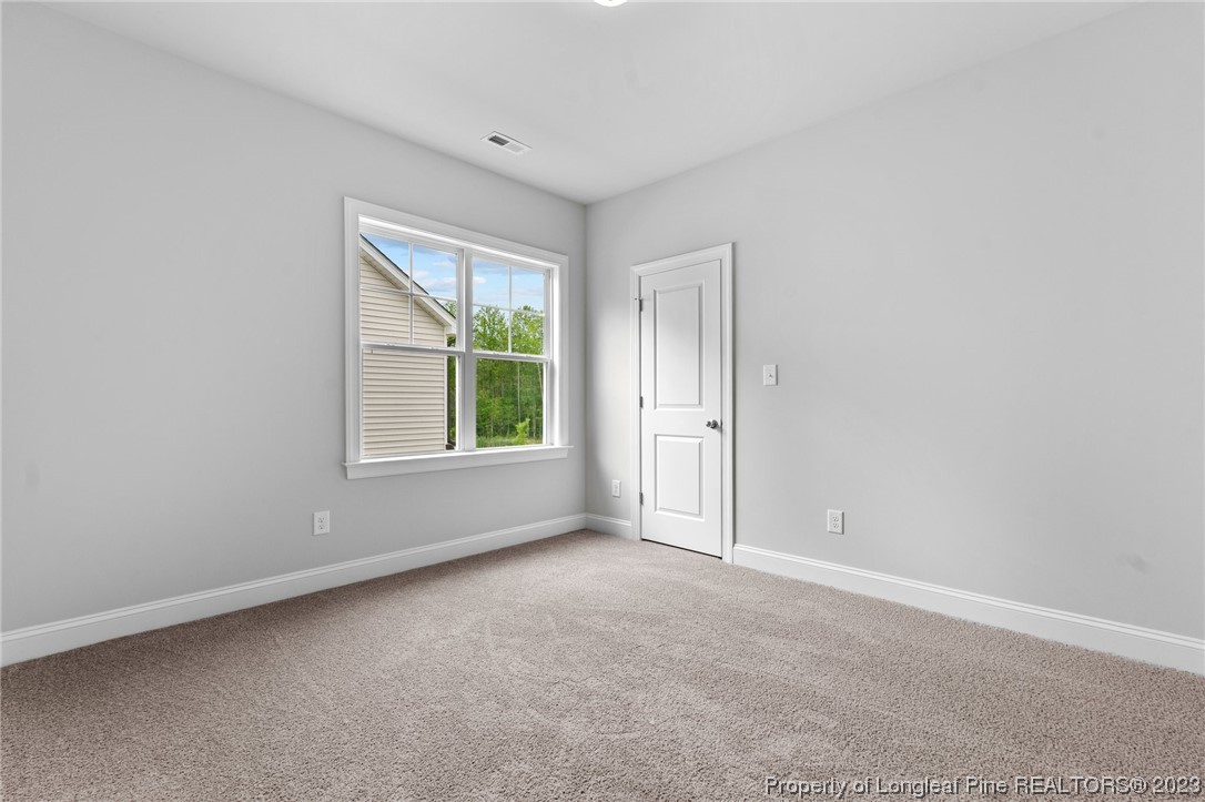 144 Kensington Dr Spring Lake Spring Lake, NC 28390 - Photo 18 of 22 a view of an empty room with a window