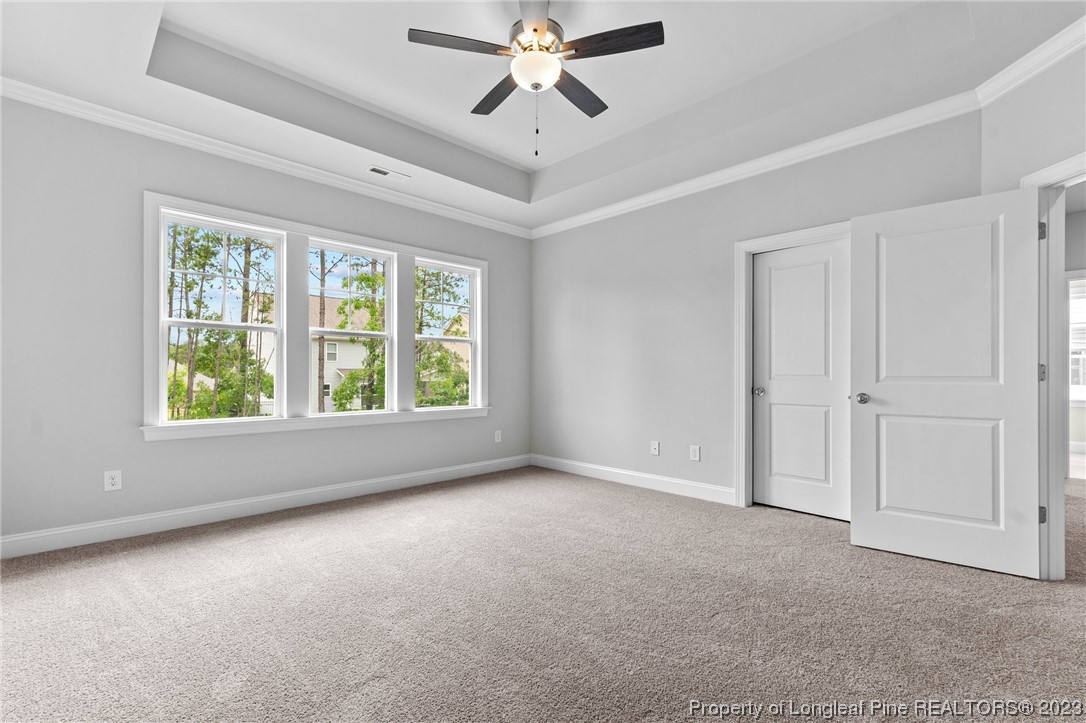 144 Kensington Dr Spring Lake Spring Lake, NC 28390 - Photo 20 of 22 a view of a livingroom with a ceiling fan and window