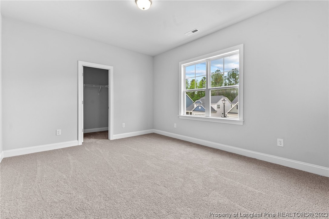 144 Kensington Dr Spring Lake Spring Lake, NC 28390 - Photo 10 of 22 an empty room with windows