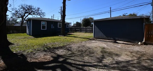 a view of a backyard of the house