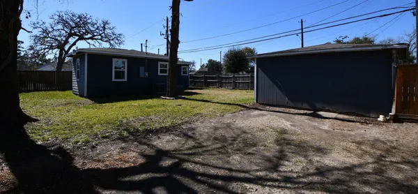 a view of a backyard of the house