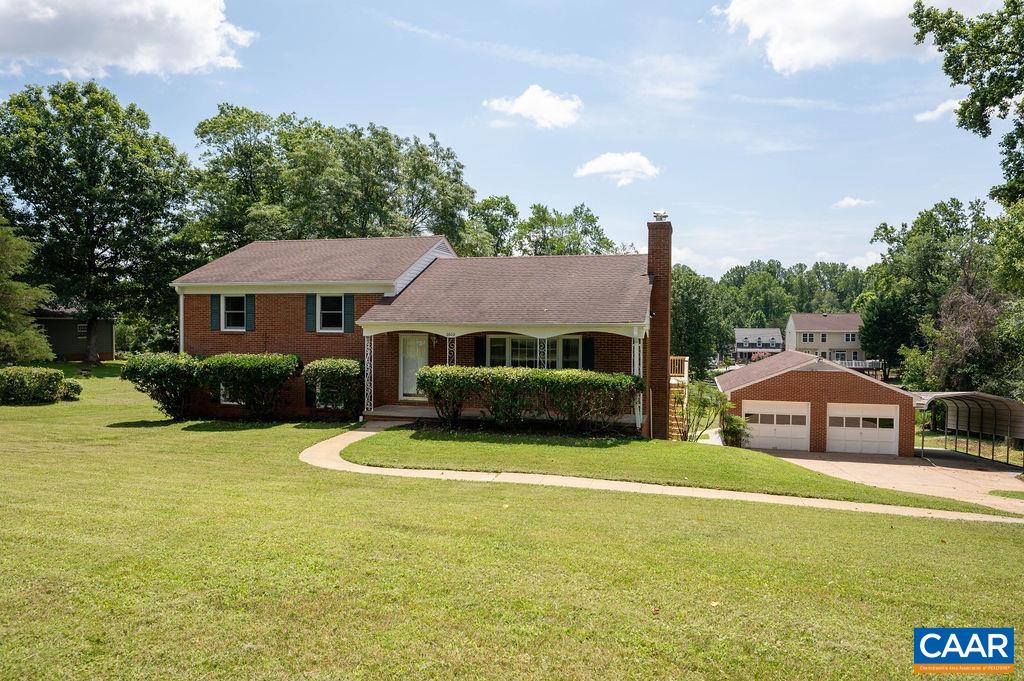 a front view of a house with swimming pool having outdoor seating