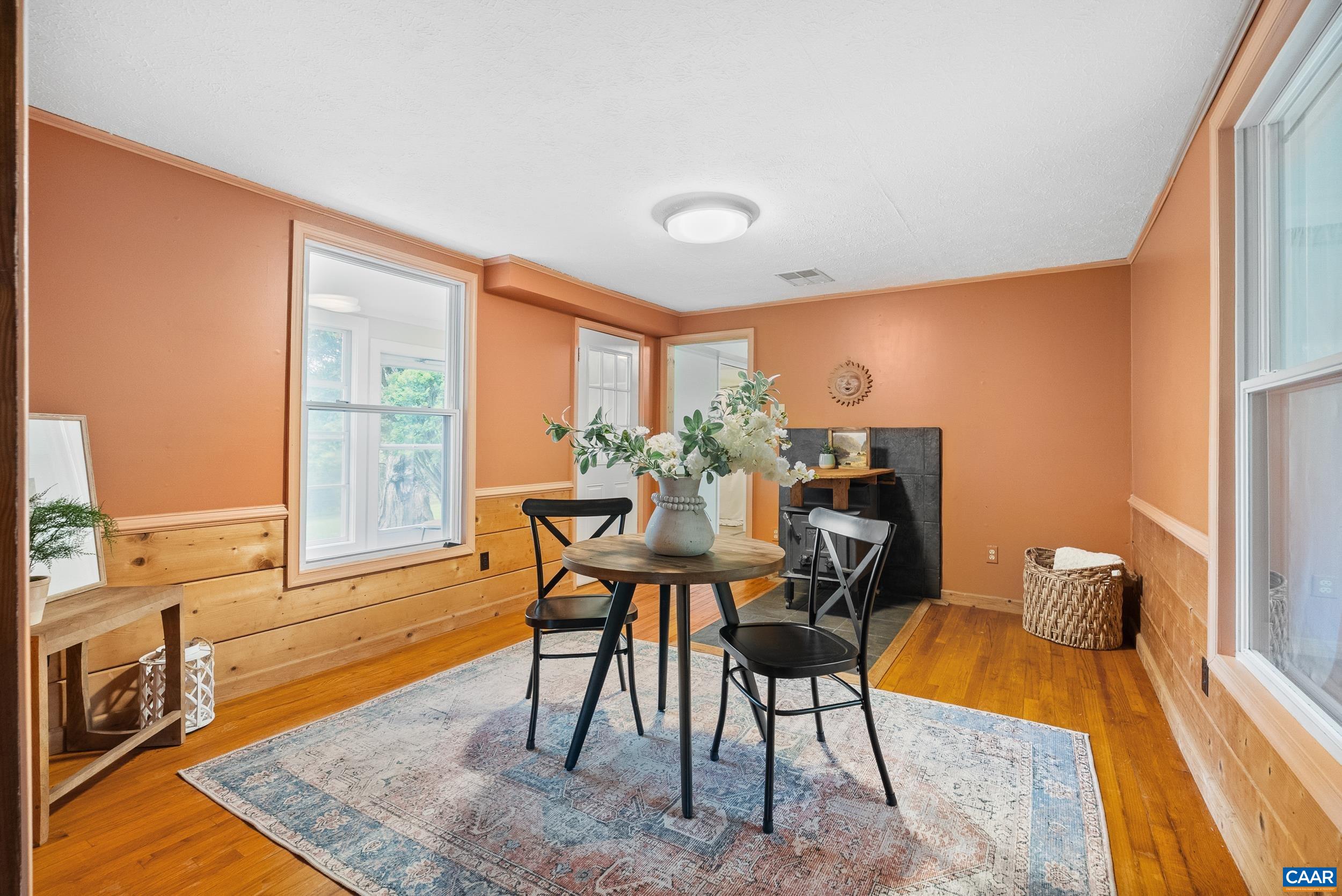 687 Gidsville Road Amherst, VA 24521 - Photo 16 of 70 a view of a dining room with furniture window and wooden floor