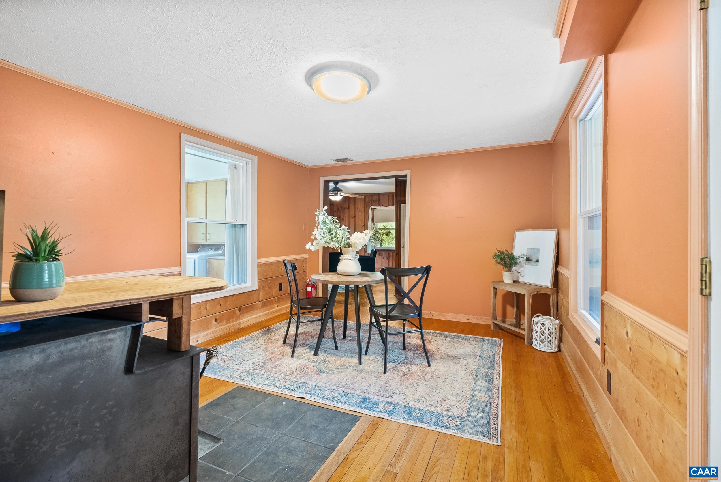 687 Gidsville Road Amherst, VA 24521 - Photo 17 of 70 a dining room with furniture and wooden floor