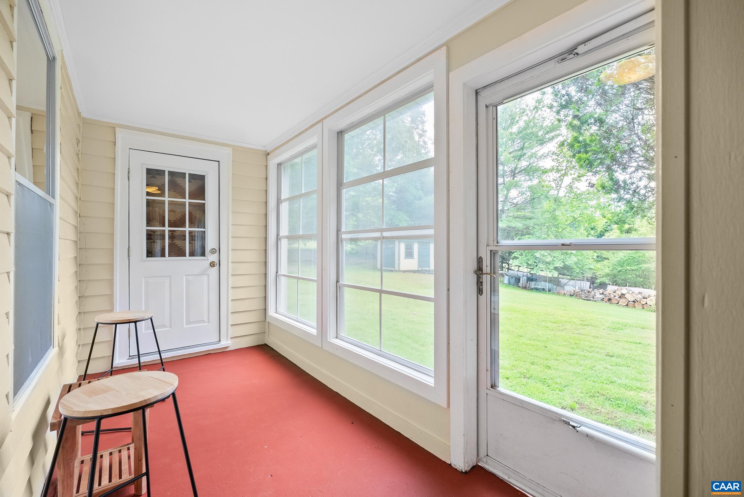 687 Gidsville Road Amherst, VA 24521 - Photo 18 of 70 a view of an empty room with wooden floor and a window